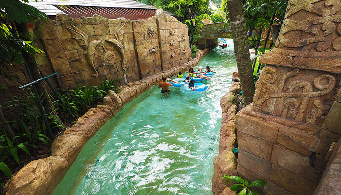 first ever hydro magnetic coaster of Asia, or you can try the thrilling water slides, or just grab a tube and watch the river passing by.  Adventure cove water park on India to singapore trip cost