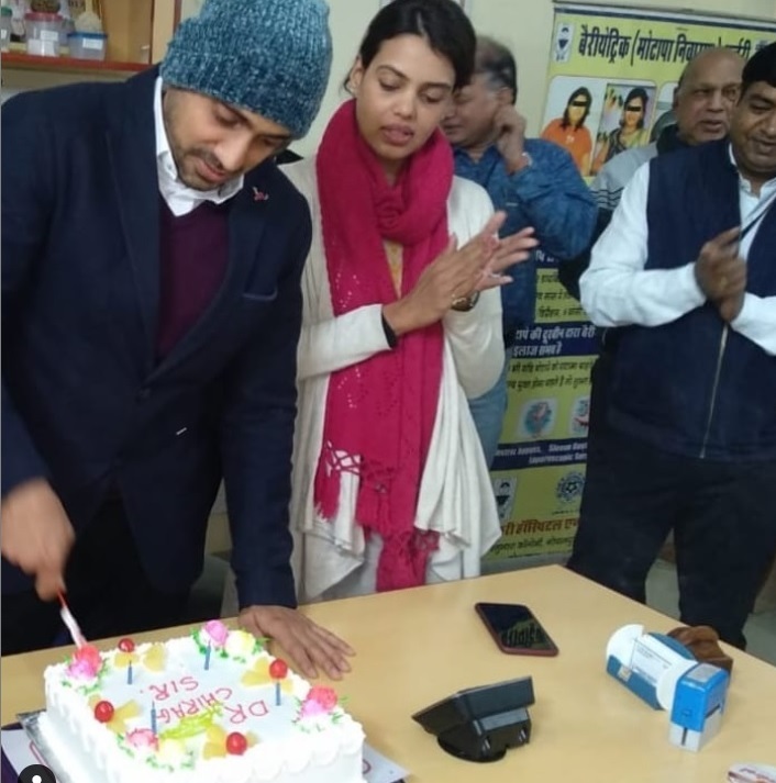 Dr. Chirag Bhandari celebrating his birthday with his wife and colleagues on 31 December