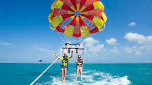 couple enjoying parasailing in Maldives 