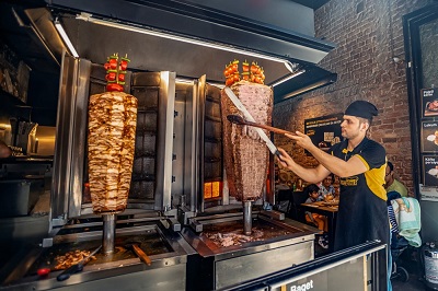 Cook Baking Shawarma in Dubai night restro